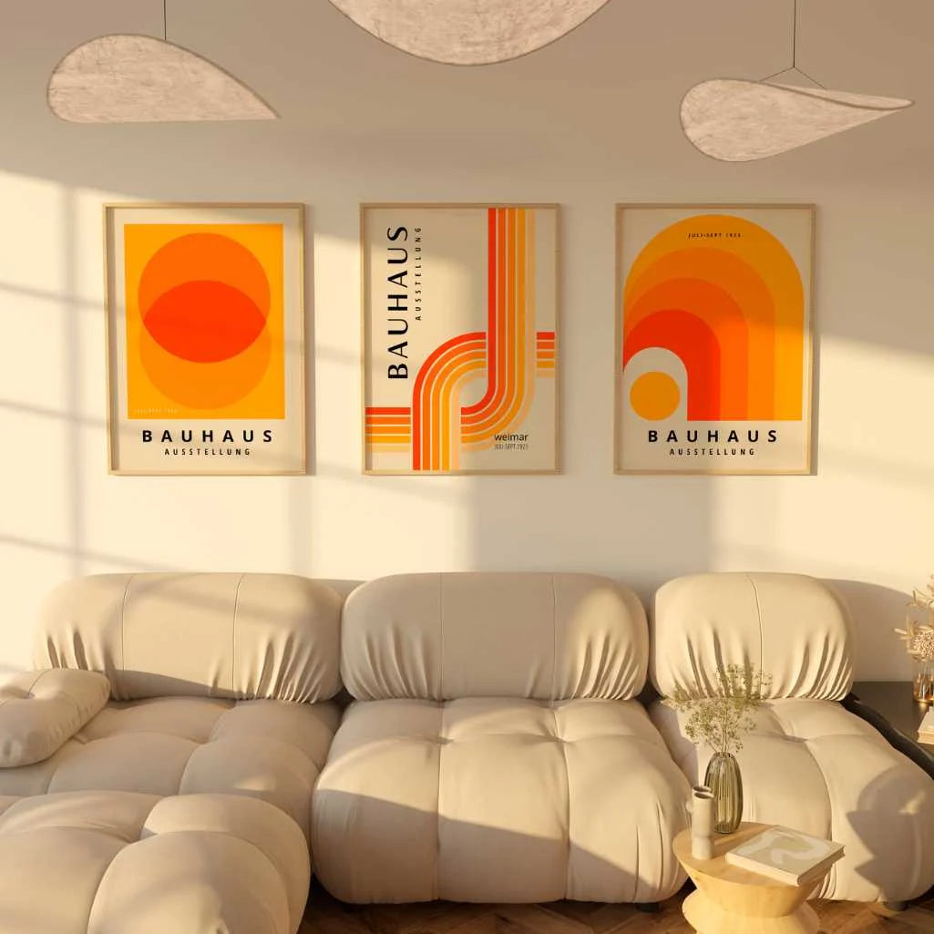 bauhaus poster set of 3 framed wall art above sofa in modern living room interior