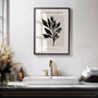 Close up of black botanical leaves poster showing bold leaf motif and beige background