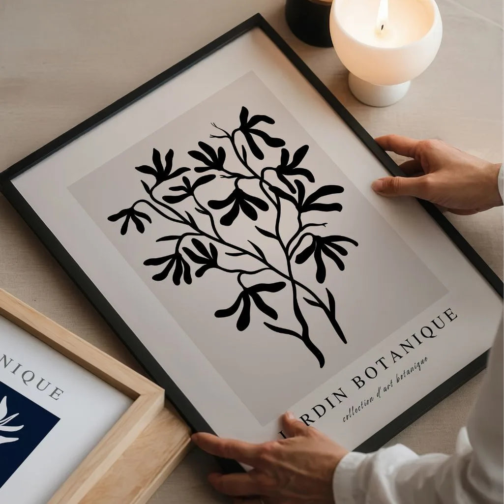 Close up of black botanical branch poster showing bold silhouette and clean contrast