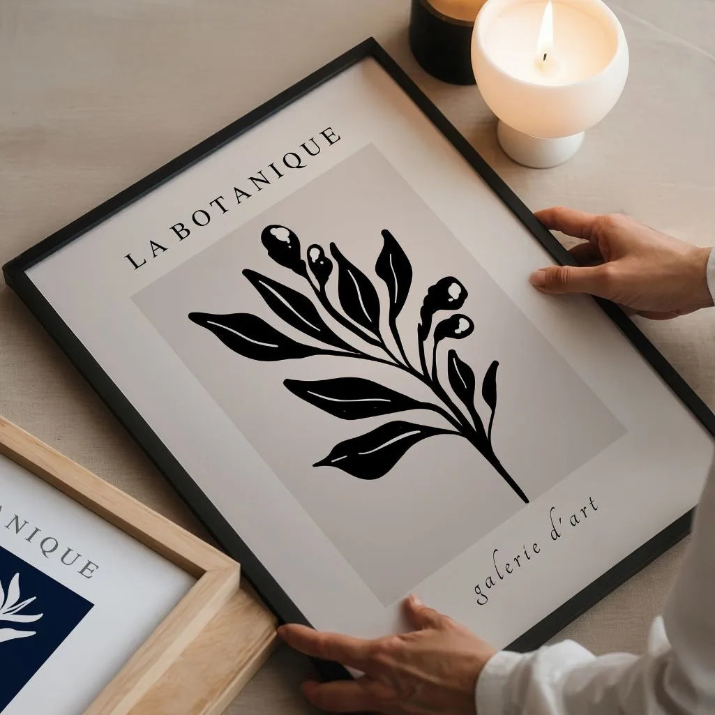 Black botanical leaves poster styled in modern living room with beige neutral decor