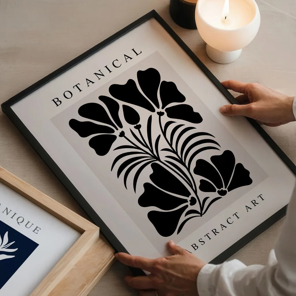 Close up of botanical abstract flower poster showing bold black shapes and clean lines