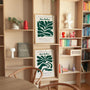 Set of 2 botanical green posters styled in modern living room with minimalist decor