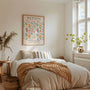 Floral watercolor poster in pastel tones styled in modern bedroom interior