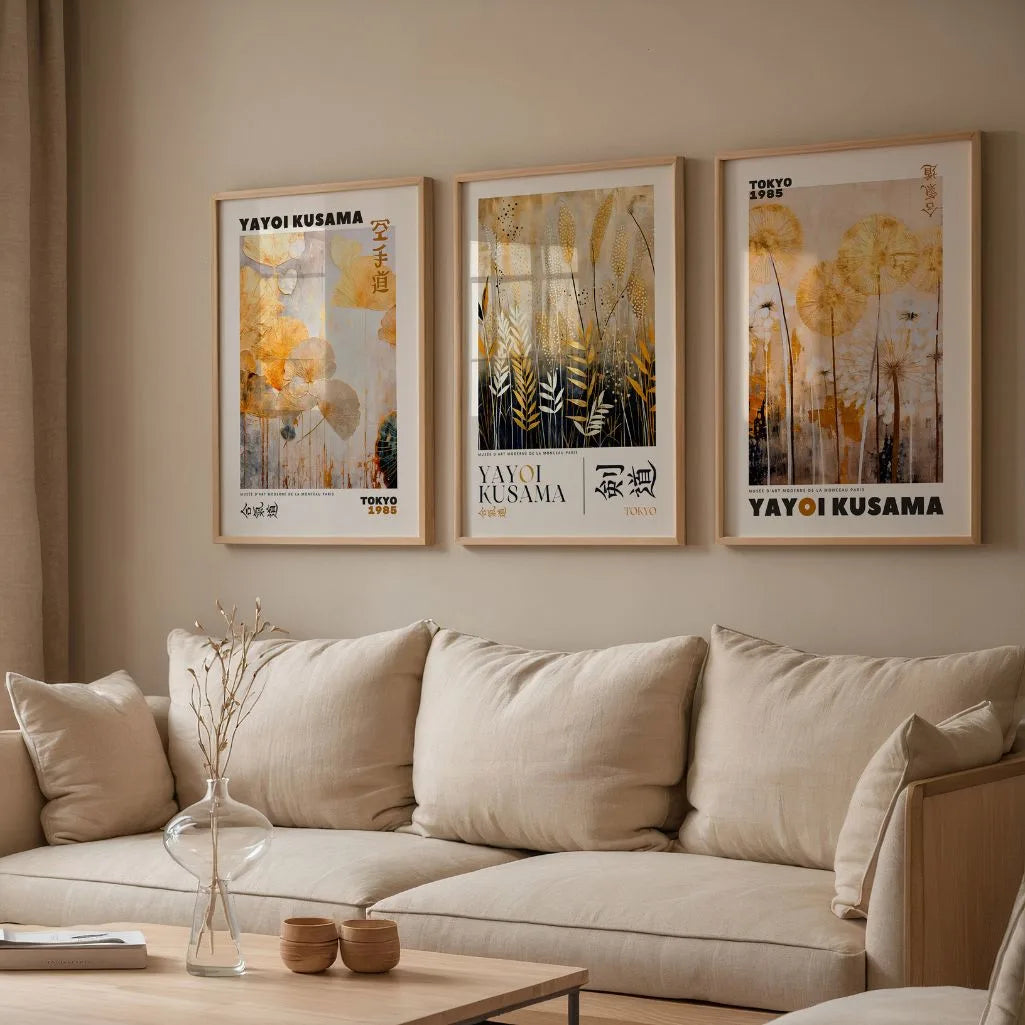 Gold botanical poster set of 3 in living room, elegant beige black wall decor above sofa