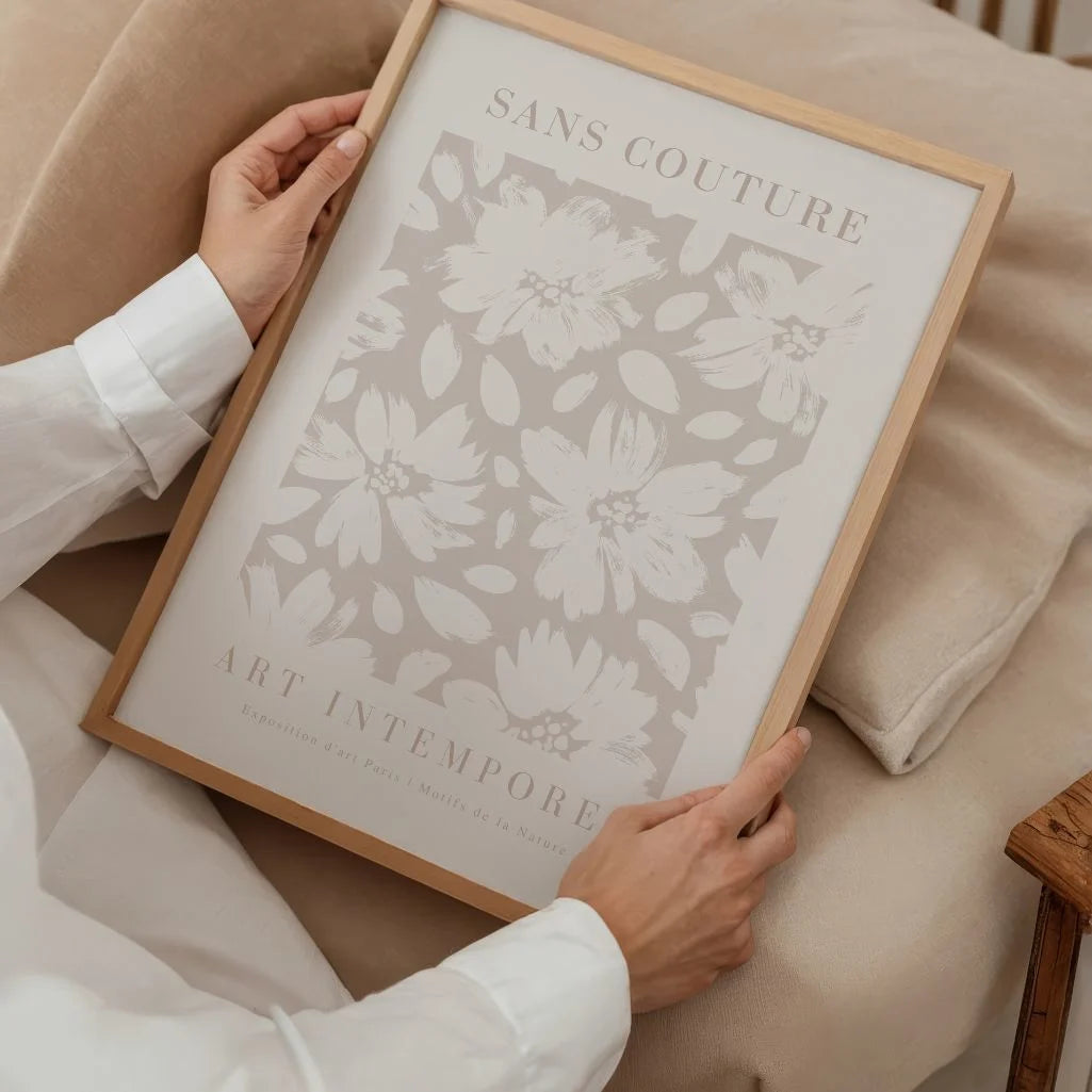Close up of pastel floral poster showing soft brush strokes and delicate flowers