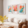 Pastel floral poster set with soft colors in modern living room decor