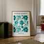 Teal flower watercolor poster styled in modern living room with botanical decor