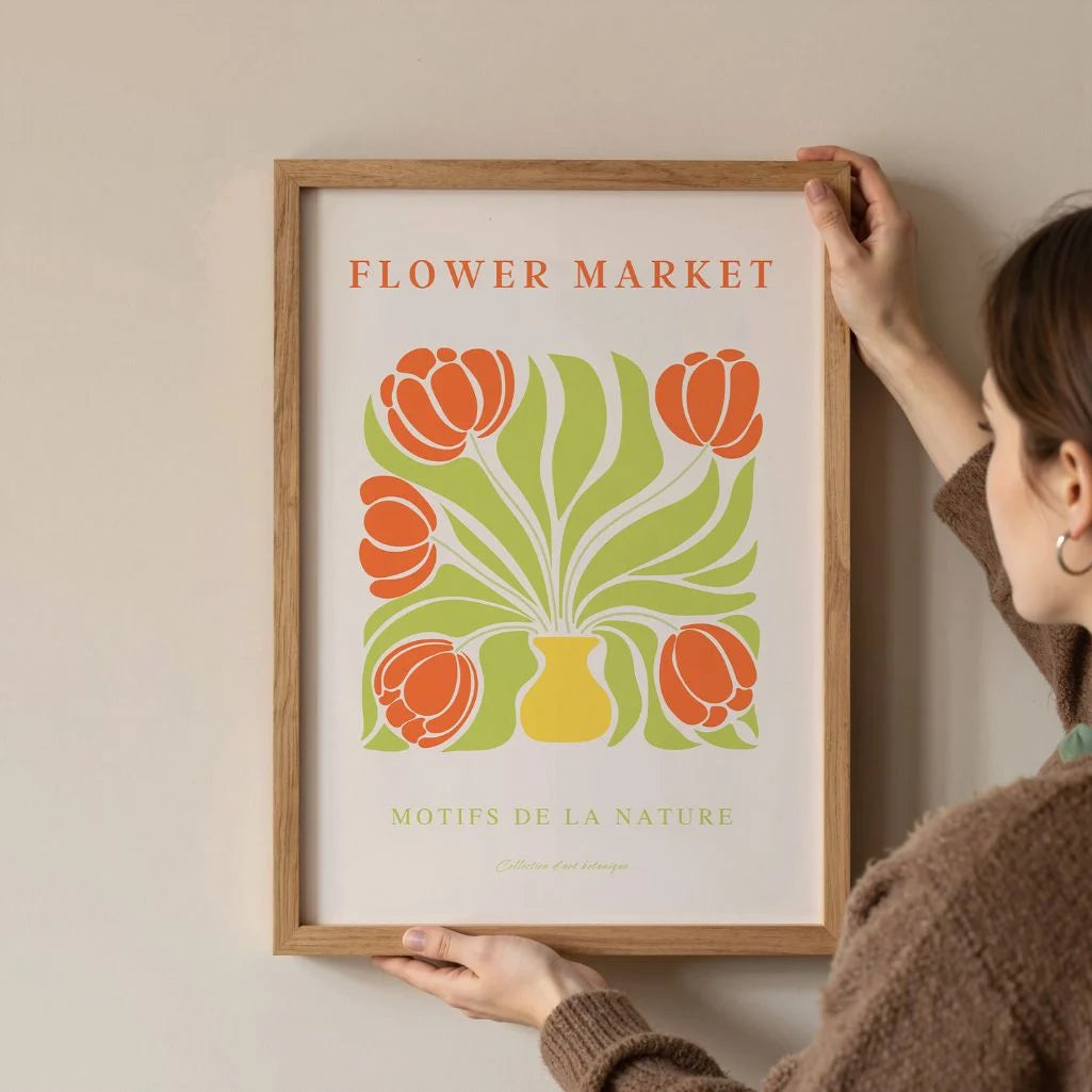 Close up of tulips in vase poster showing vivid orange petals and green tones