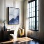 Watercolor landscape posters arranged as gallery wall in modern calm interior
