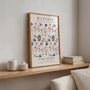 Watercolour garden poster in soft pastel tones styled in modern bedroom interior