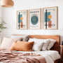 orange and green bauhaus poster set arranged in modern gallery wall with strong contrast